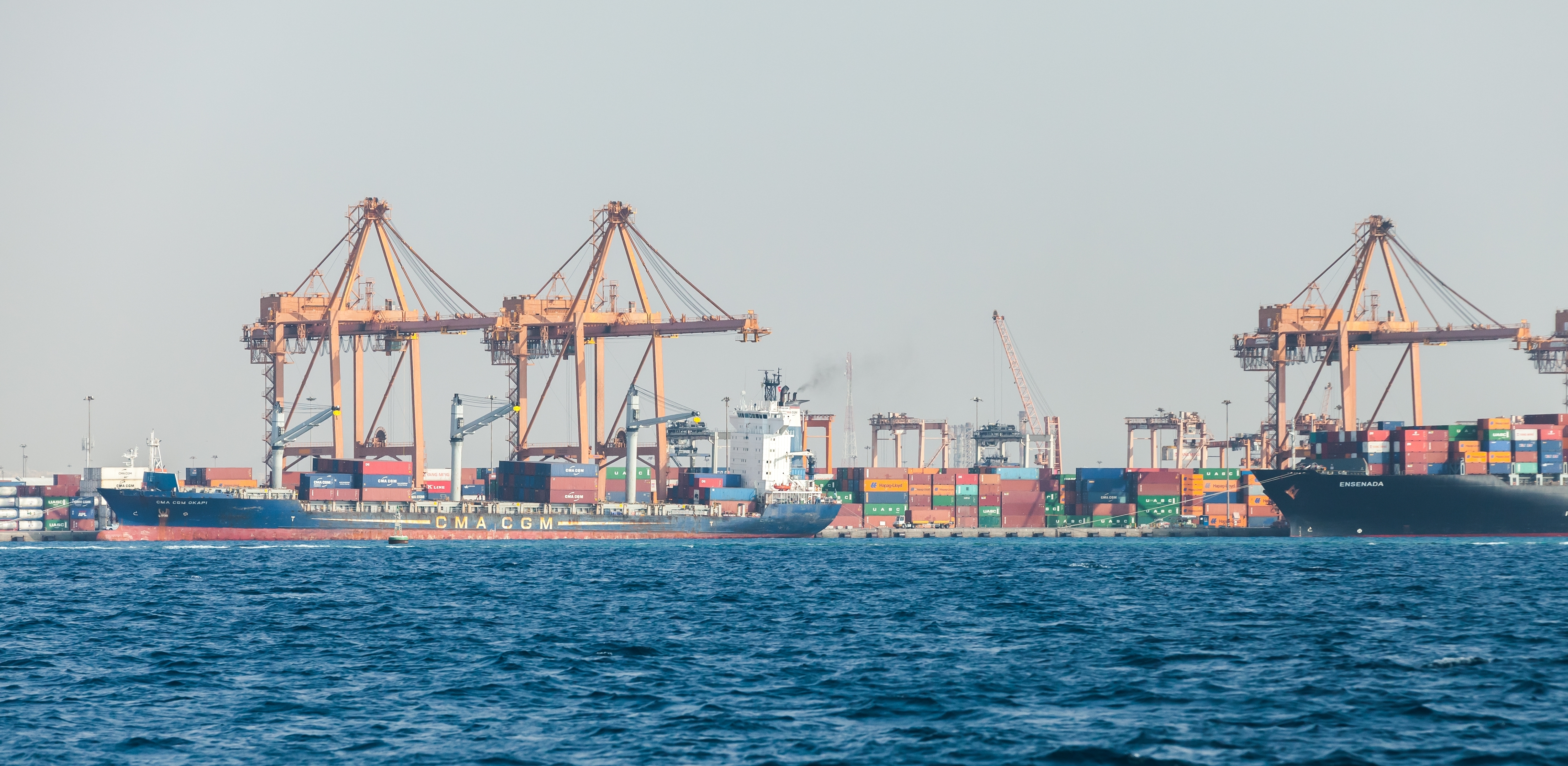 Container cranes and cargo ships at Jeddah Islamic Port, Saudi Arabia